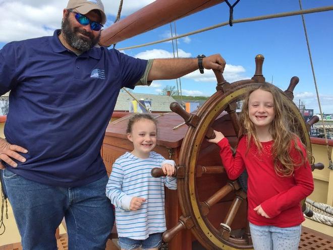 Pictured (from left) are OHP Able Seaman Carmine Russo (Clearwater, Fla.) with visitors Laila and Georgia Hekking (Newport). © OHPRI